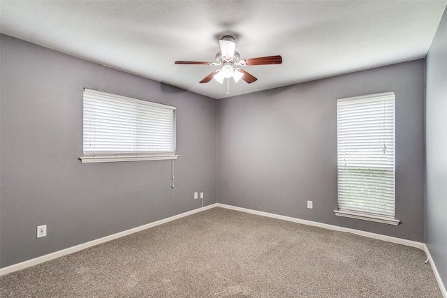 8688 Grenadier Ct, Dallas, TX 75238 - spare room with a ceiling fan, carpet floors, and plenty of natural light