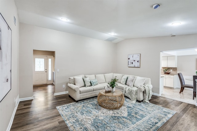 8688 Grenadier Ct, Dallas, TX 75238 - living room featuring vaulted ceiling and wood finished floors