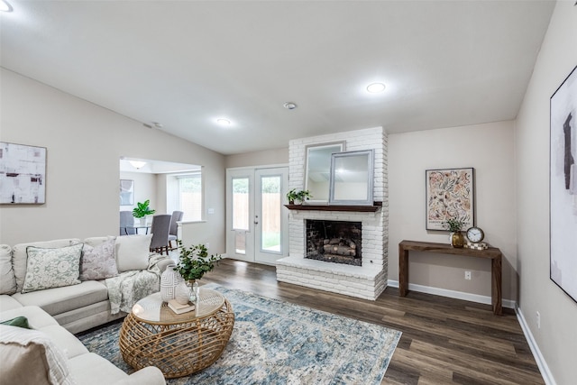 8688 Grenadier Ct, Dallas, TX 75238 - living room with dark wood finished floors, a brick fireplace, lofted ceiling, and recessed lighting