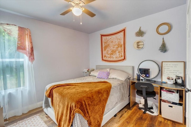 311 W Oak St, Whitewright, TX 75491 - bedroom featuring wood finished floors and a ceiling fan