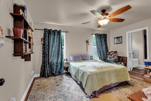 311 W Oak St, Whitewright, TX 75491 - bedroom with wood finished floors and a ceiling fan