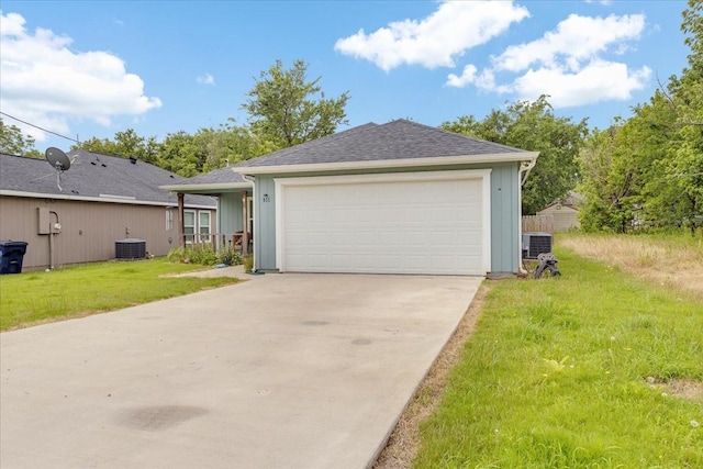 311 W Oak St, Whitewright, TX 75491 - view of front facade with a front lawn, concrete driveway, and a garage