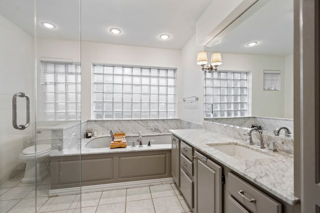 7845 Blackbird Ln, Dallas, TX 75238 - full bathroom with vanity, a garden tub, tile patterned flooring, a stall shower, and a chandelier