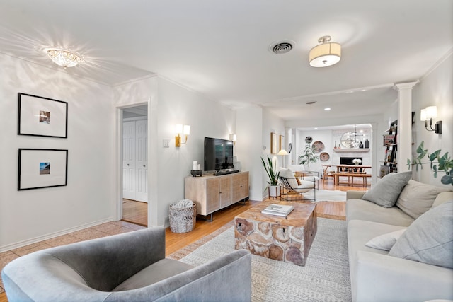 7845 Blackbird Ln, Dallas, TX 75238 - living room with decorative columns and light wood finished floors