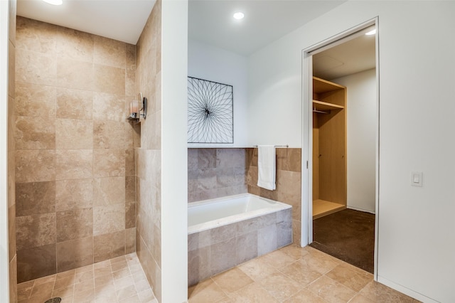 2430 Victory Park Ln Unit 1906, Dallas, TX 75219 - full bath with a garden tub, tiled shower, tile patterned floors, and recessed lighting