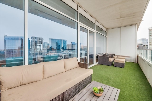 2430 Victory Park Ln Unit 1906, Dallas, TX 75219 - balcony featuring outdoor lounge area and a city view