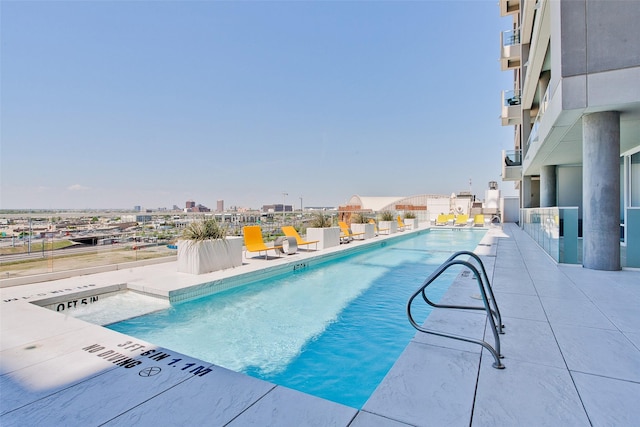 2430 Victory Park Ln Unit 1906, Dallas, TX 75219 - community pool with a city view and a patio