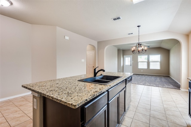 408 Citation Ln, Ponder, TX 76259 - kitchen with arched walkways, light tile patterned flooring, a chandelier, dishwasher, and pendant lighting