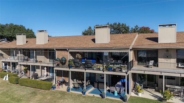 849 S Gun Barrel Ln Unit D6, Gun Barrel City, TX 75156 - rear view of property with a chimney, a patio, a shingled roof, and a balcony