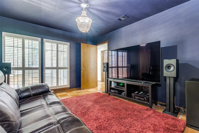 1507 Abrams Rd, Dallas, TX 75214 - tiled living room featuring a chandelier and baseboards