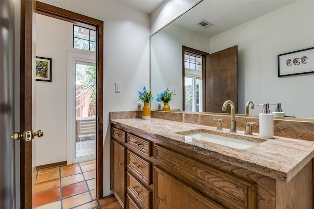 1507 Abrams Rd, Dallas, TX 75214 - bathroom with vanity and tile patterned flooring