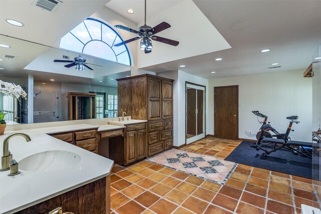 1507 Abrams Rd, Dallas, TX 75214 - bathroom with a ceiling fan, double vanity, recessed lighting, a shower stall, and tile patterned flooring