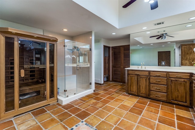 1507 Abrams Rd, Dallas, TX 75214 - full bath featuring a ceiling fan, recessed lighting, double vanity, a stall shower, and tile patterned flooring