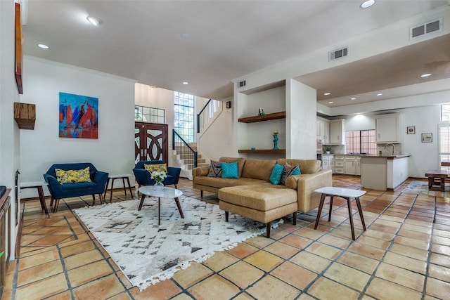 1507 Abrams Rd, Dallas, TX 75214 - living area with recessed lighting, stairs, and light tile patterned floors