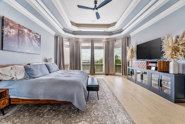 8800 Summit Point Ct, Fort Worth, TX 76179 - bedroom with a raised ceiling, ornamental molding, wood finished floors, a ceiling fan, and access to outside