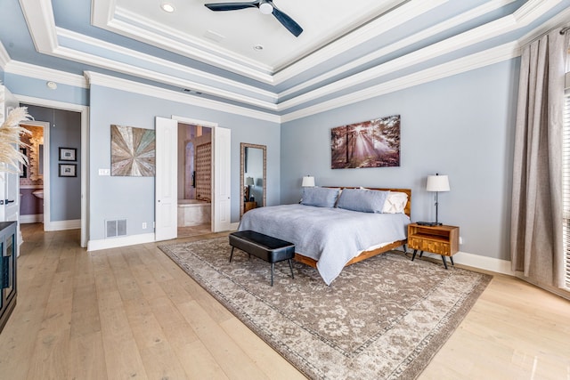 8800 Summit Point Ct, Fort Worth, TX 76179 - bedroom with a raised ceiling, crown molding, light wood-type flooring, a ceiling fan, and ensuite bath