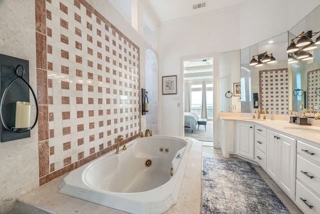 8800 Summit Point Ct, Fort Worth, TX 76179 - ensuite bathroom featuring double vanity, a tub with jets, and crown molding