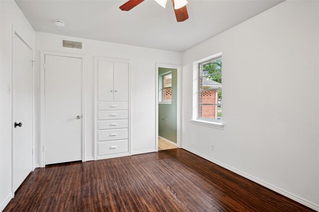 522 Carol Ct, Richardson, TX 75081 - unfurnished bedroom with wood finished floors and ceiling fan