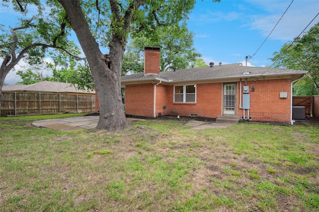 522 Carol Ct, Richardson, TX 75081 - back of house with a chimney, brick siding, entry steps, and a shingled roof