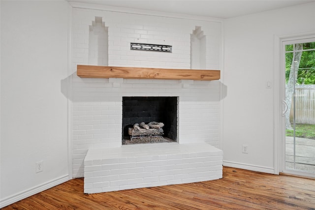522 Carol Ct, Richardson, TX 75081 - detailed view of wood finished floors and a fireplace