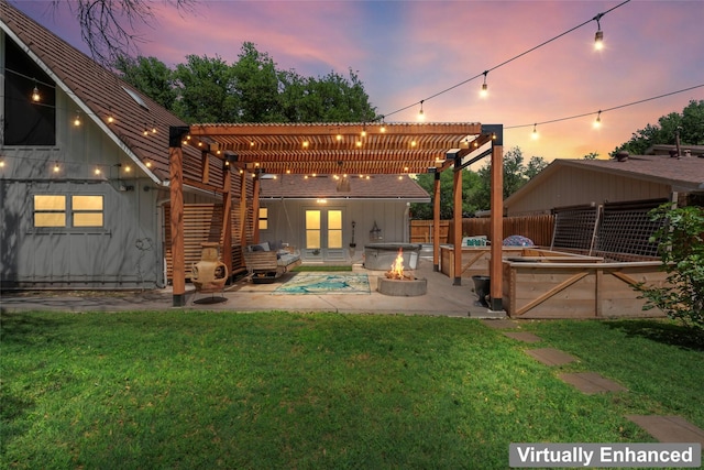 1258 Canterbury Dr, Abilene, TX 79602 - back of property at dusk with board and batten siding, a pergola, a covered hot tub, and an outdoor fire pit