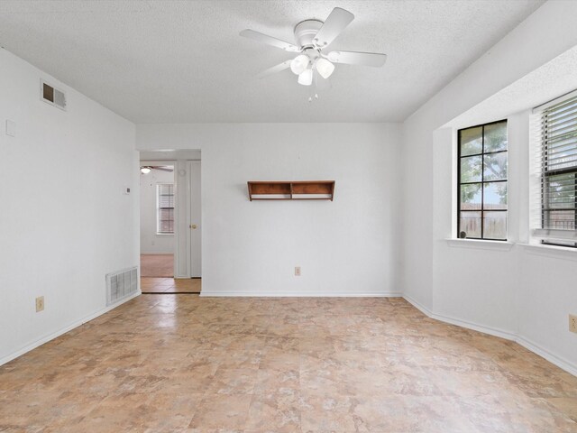 713 Brookhaven Dr, Royse City, TX 75189 - unfurnished room with ceiling fan and a textured ceiling