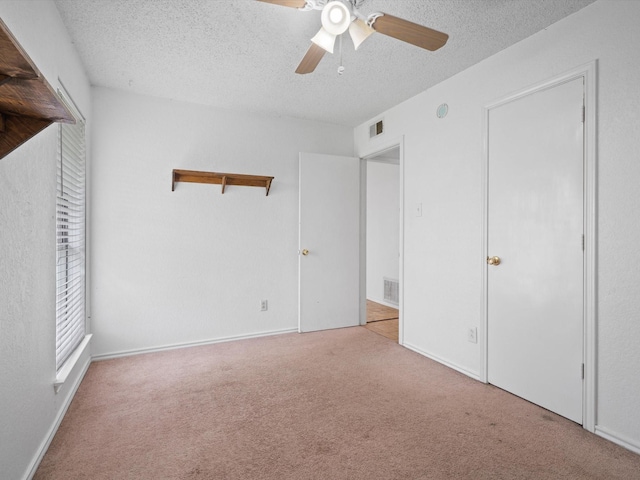 713 Brookhaven Dr, Royse City, TX 75189 - unfurnished bedroom with a textured ceiling, carpet floors, and ceiling fan