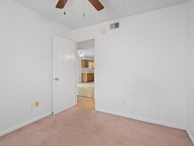 713 Brookhaven Dr, Royse City, TX 75189 - spare room with a ceiling fan, carpet floors, a smoke detector, and a textured ceiling
