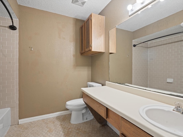713 Brookhaven Dr, Royse City, TX 75189 - full bathroom featuring vanity,  shower combination, a textured ceiling, and tile patterned floors