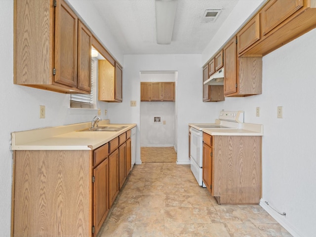 713 Brookhaven Dr, Royse City, TX 75189 - kitchen featuring electric stove, under cabinet range hood, brown cabinetry, and light countertops