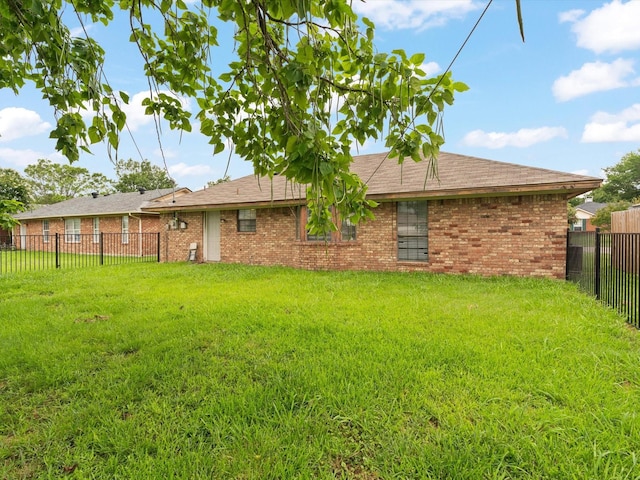 713 Brookhaven Dr, Royse City, TX 75189 - back of house featuring brick siding and a fenced backyard
