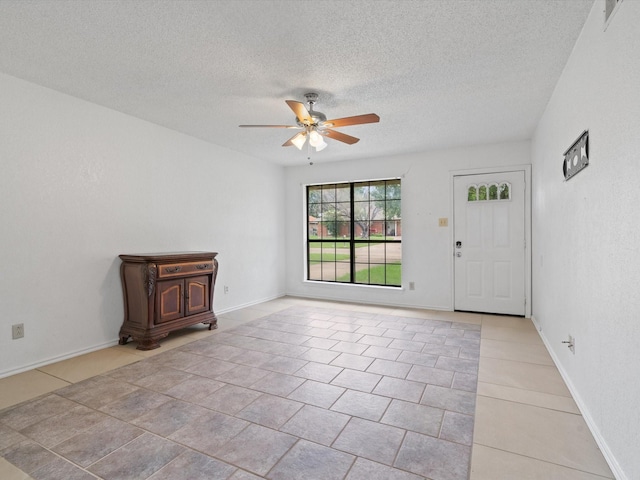 713 Brookhaven Dr, Royse City, TX 75189 - tiled entryway with ceiling fan and a textured ceiling
