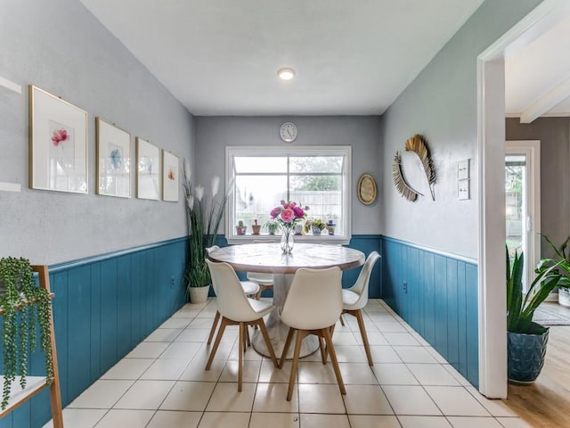 417 Merriman Dr, Highland Village, TX 75077 - dining room with a wainscoted wall, wooden walls, and tile patterned flooring