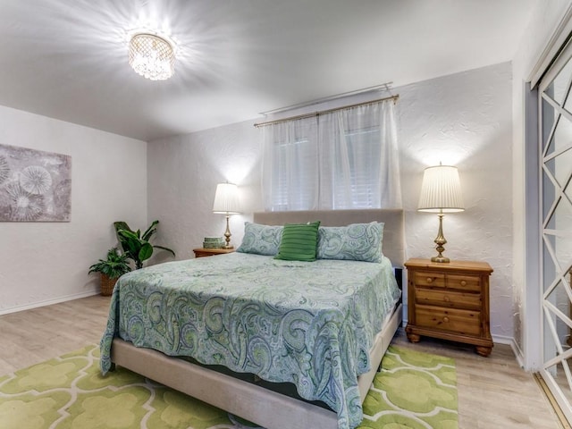 417 Merriman Dr, Highland Village, TX 75077 - bedroom featuring wood finished floors and a textured wall