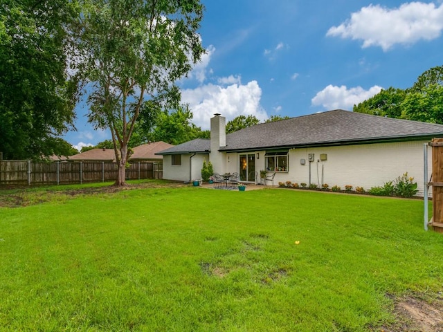 417 Merriman Dr, Highland Village, TX 75077 - back of property featuring a chimney and a patio area