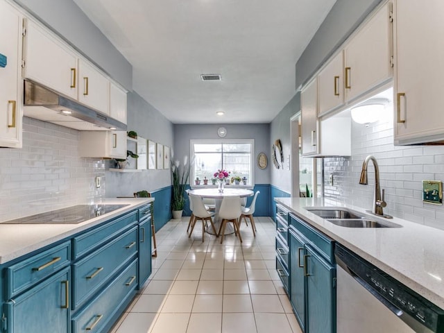 417 Merriman Dr, Highland Village, TX 75077 - kitchen featuring dishwasher, black electric stovetop, and blue cabinetry