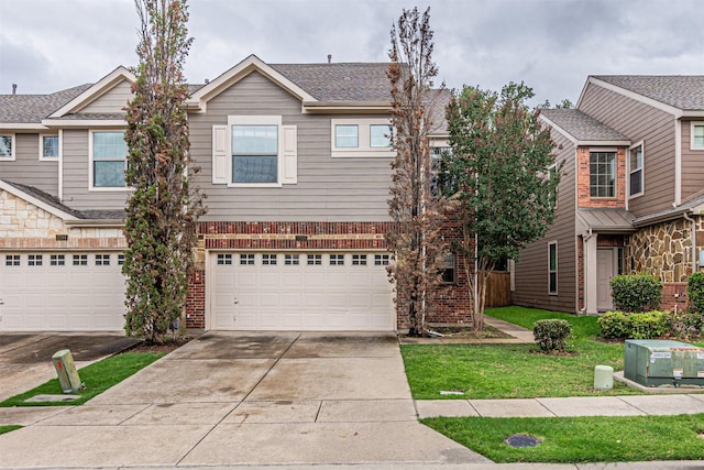 2268 Fletcher Trl, Plano, TX 75025 - view of front of house with brick siding, concrete driveway, an attached garage, and a front lawn