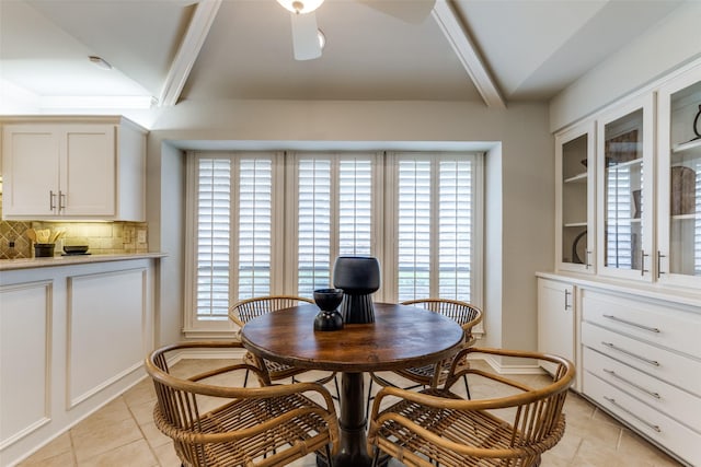 6404 Camille Ave, Dallas, TX 75252 - dining area featuring light tile patterned floors, beam ceiling, and ceiling fan