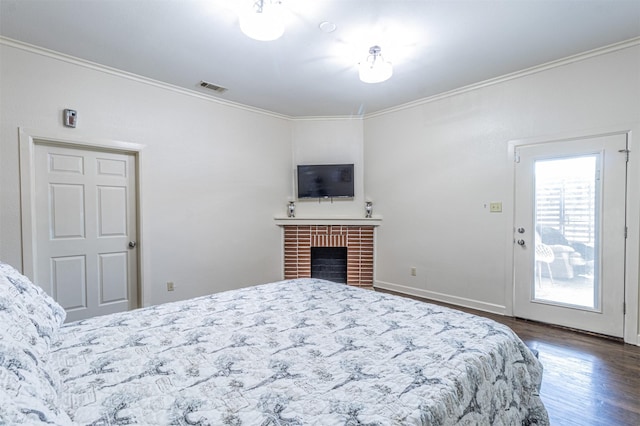 825 W 12th St, Dallas, TX 75208 - bedroom featuring wood finished floors, crown molding, and a fireplace
