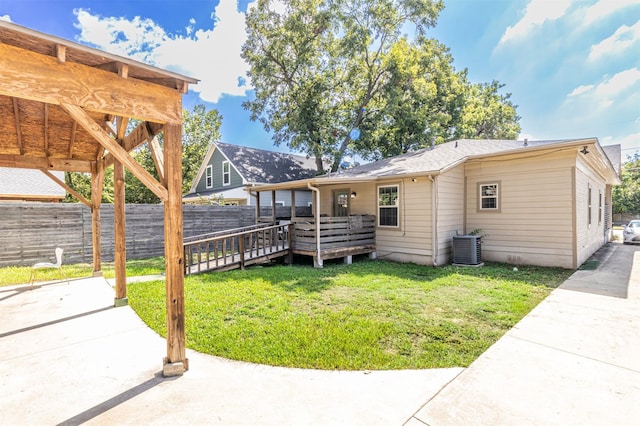 825 W 12th St, Dallas, TX 75208 - rear view of house with a wooden deck and a patio