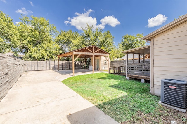 825 W 12th St, Dallas, TX 75208 - fenced backyard with a shed, a patio area, and a deck