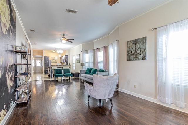 825 W 12th St, Dallas, TX 75208 - living area with ornamental molding, plenty of natural light, wood finished floors, and a ceiling fan