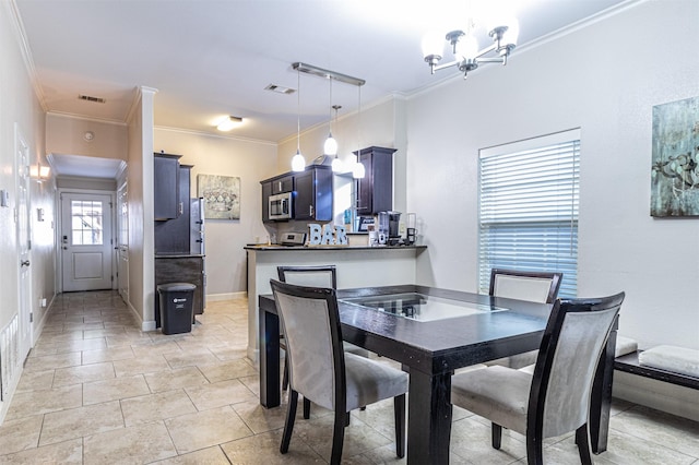 825 W 12th St, Dallas, TX 75208 - dining space featuring ornamental molding and a chandelier