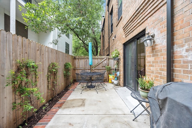 4143 Newton Ave Unit C, Dallas, TX 75219 - fenced backyard featuring a patio, outdoor dining area, and grilling area