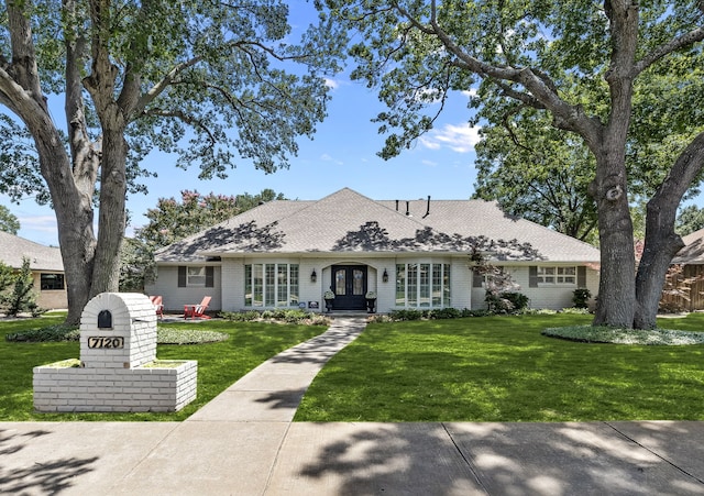 7120 Leameadow Dr, Dallas, TX 75248 - view of front of property with french doors, a front lawn, roof with shingles, and brick siding