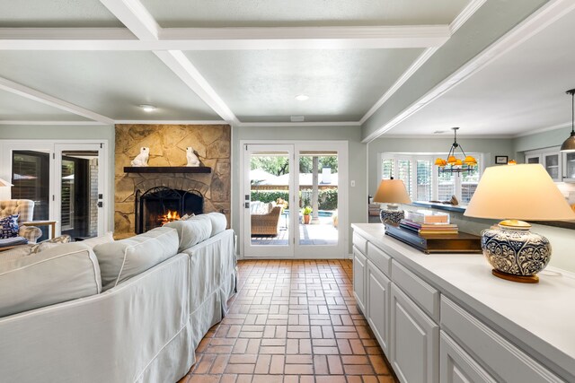 7120 Leameadow Dr, Dallas, TX 75248 - living area featuring a stone fireplace, brick flooring, a chandelier, and french doors