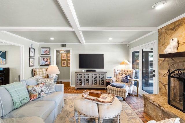 7120 Leameadow Dr, Dallas, TX 75248 - living area with brick floors, a stone fireplace, crown molding, beam ceiling, and recessed lighting