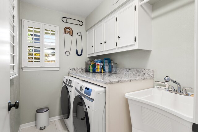7120 Leameadow Dr, Dallas, TX 75248 - laundry area featuring cabinet space, washing machine and clothes dryer, and tile patterned flooring