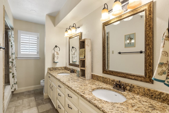 7120 Leameadow Dr, Dallas, TX 75248 - bathroom featuring double vanity, stone finish flooring, and shower / tub combo
