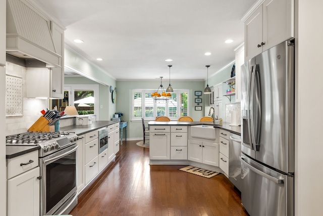 7120 Leameadow Dr, Dallas, TX 75248 - kitchen with stainless steel appliances, a peninsula, dark countertops, custom exhaust hood, and decorative backsplash